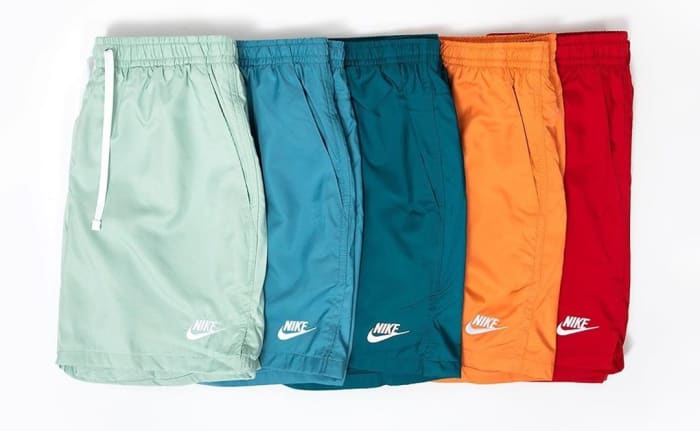 View of green, blue, orange, and red Nike shorts.